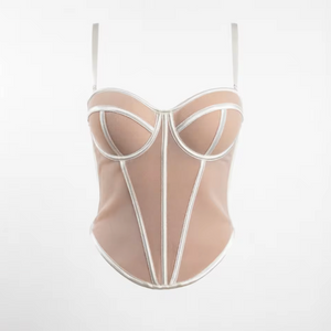 Beige handmade corset bustier with structured white piping, sweetheart neckline, and adjustable spaghetti straps.