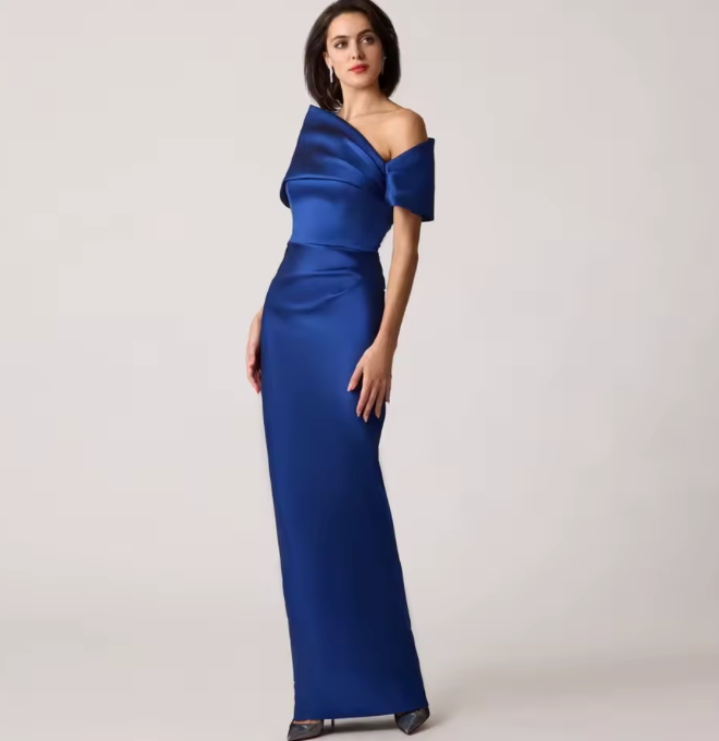 Royal blue stretch-mikado floor-length gown with an asymmetrical off-shoulder neckline and sculptural arm cuff.