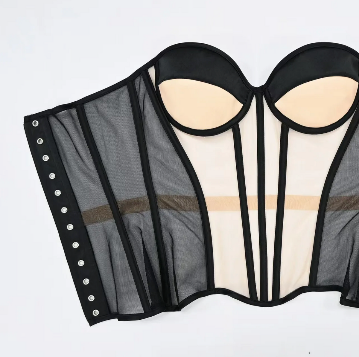 Dora handmade black mesh strapless corset with structured boning, padded cups, and silver grommet side closure.