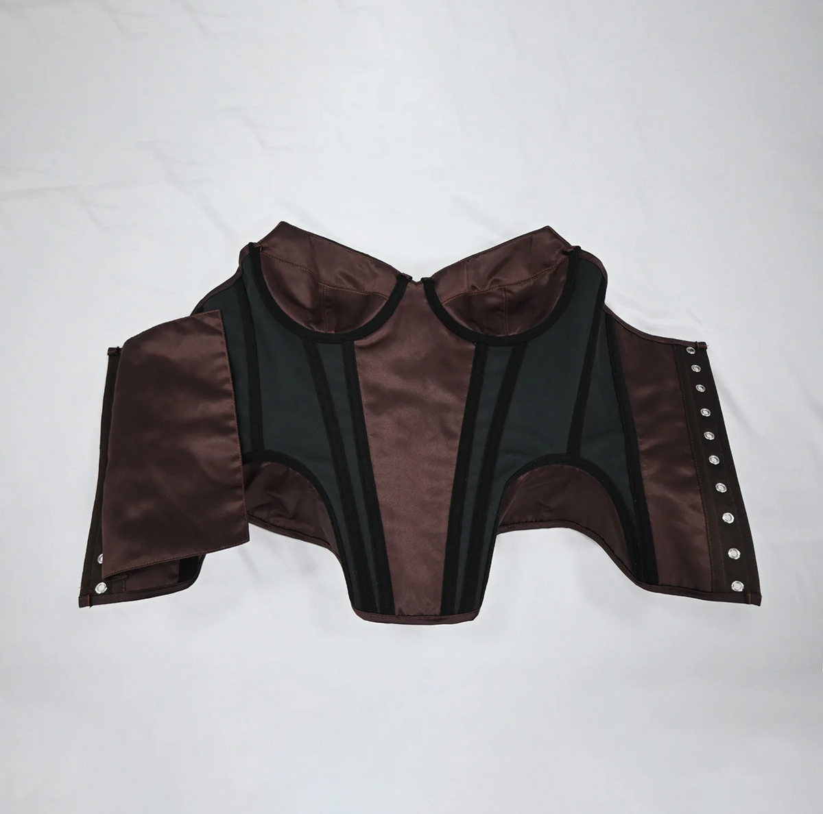 Brown satin corset bustier with structured black boning, sweetheart neckline, and metal hook-and-eye front closure.