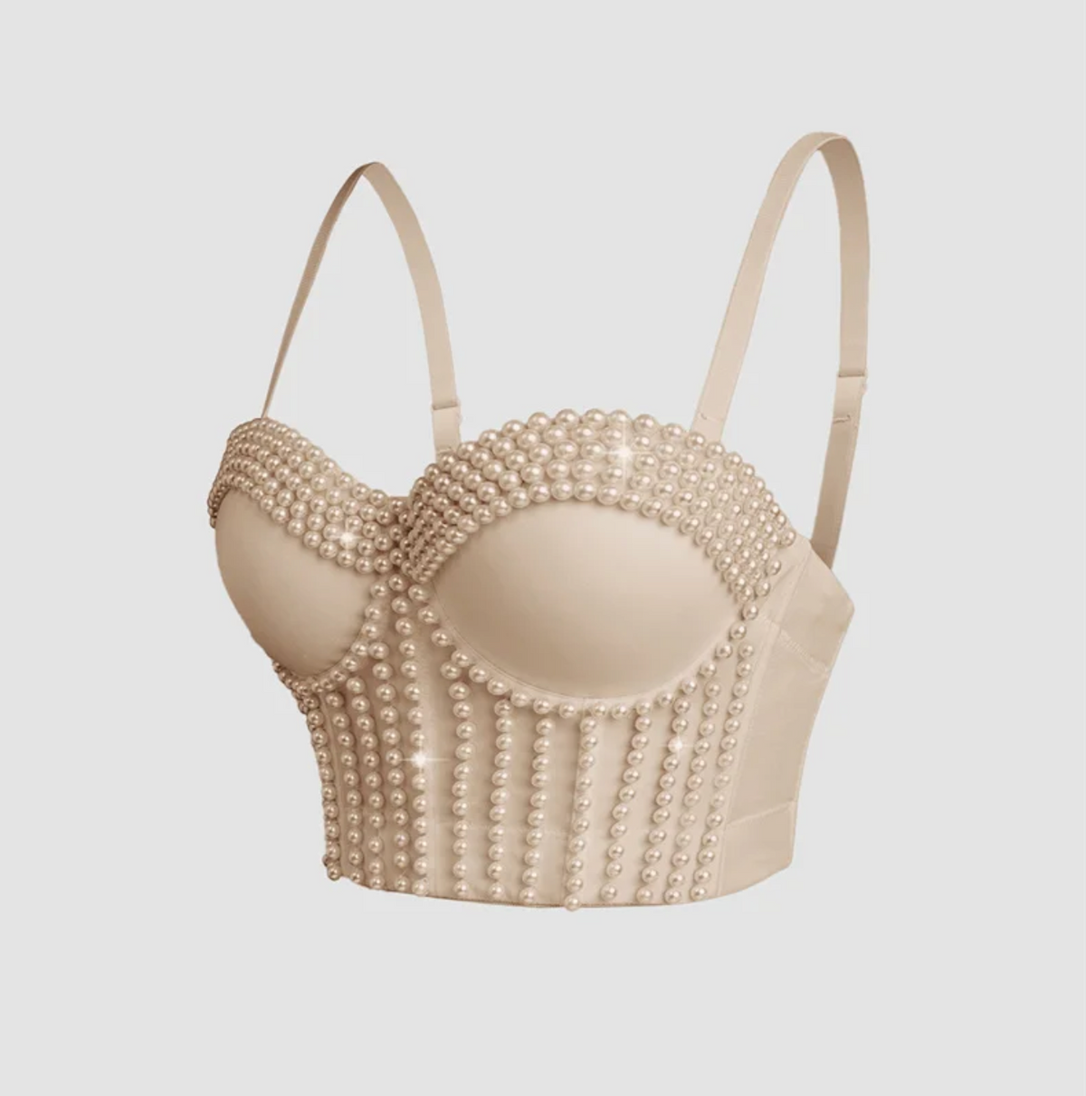 Beige handmade corset camisole featuring vertical rows of decorative pearls and adjustable spaghetti straps.