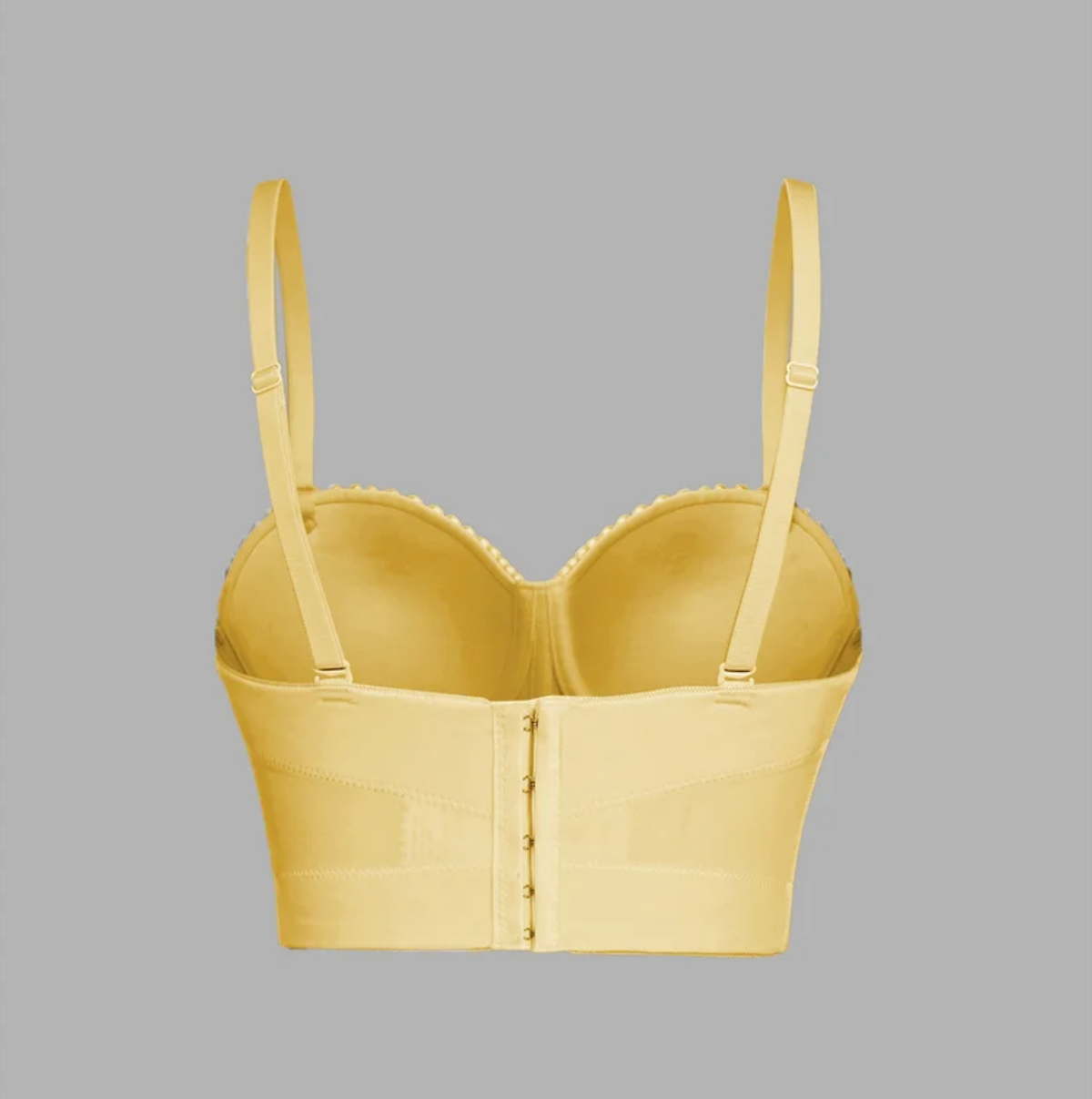 Back view of a yellow handmade Ina corset camisole with adjustable straps and a hook-and-eye back closure.