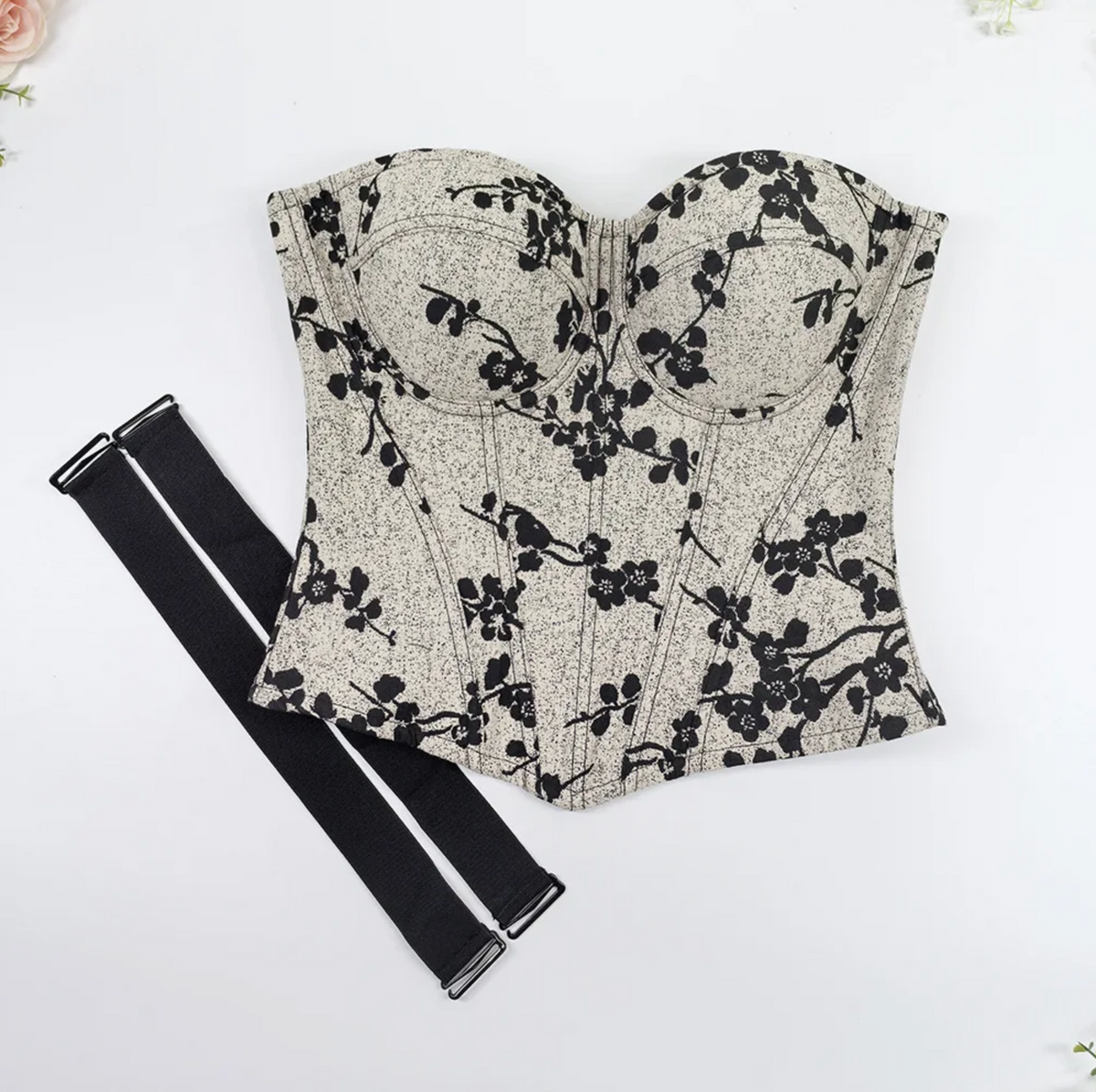 Beige and black floral print over-bust corset with structured cups, steel boning, and detachable black shoulder straps.