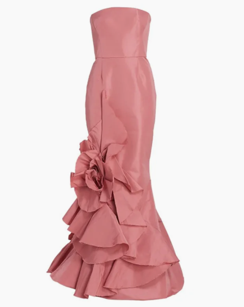 Rosetta gown in dusty rose faille with a strapless bodice and a large 3D floral accent on the ruffled skirt.