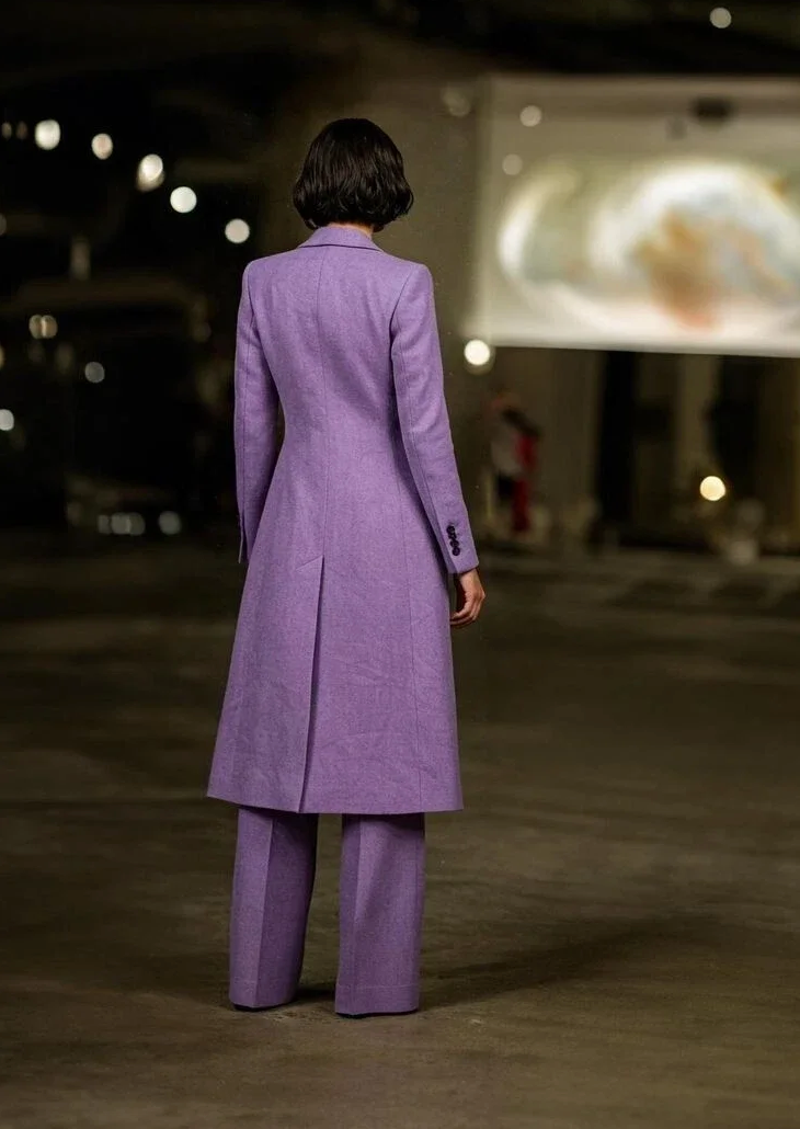 Woman wearing the purple Sybaris Three Piece Suit