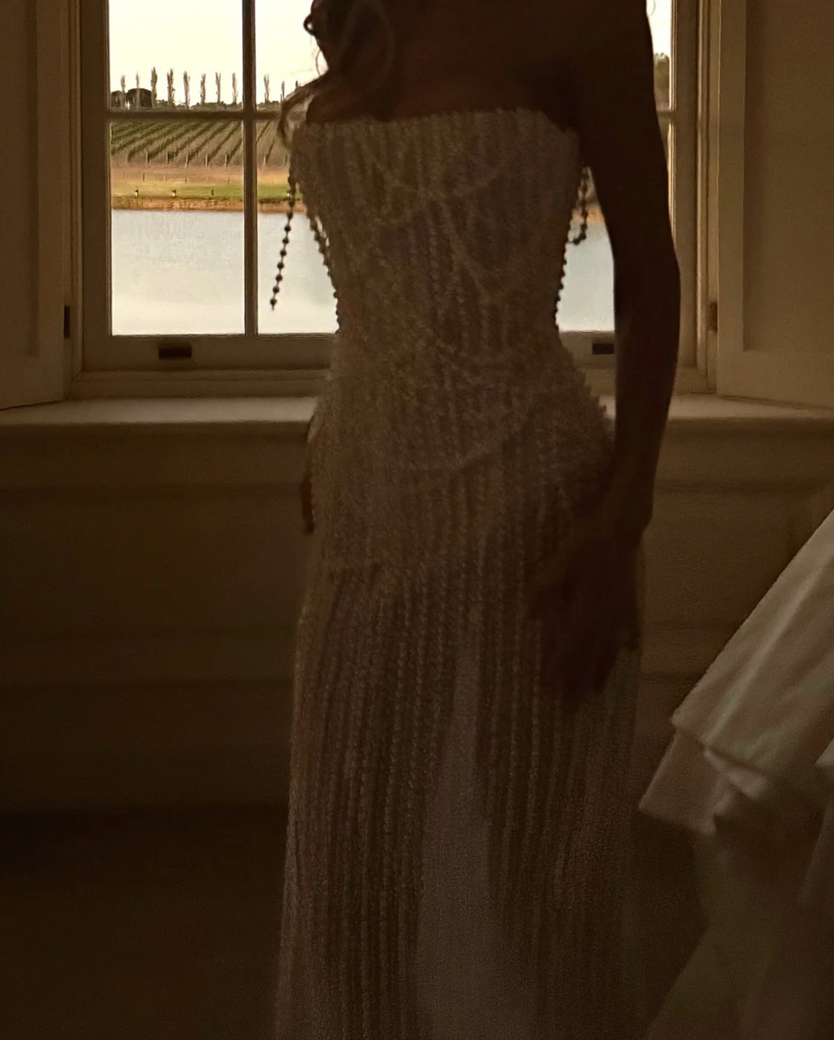 Woman wearing the Old Money Collection The Weaverly Party Dress