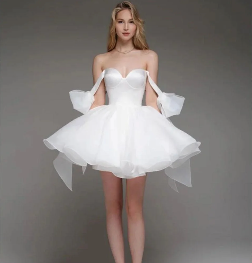 Woman wearing the Old Money Collection Couture Wekiva Mini Dress