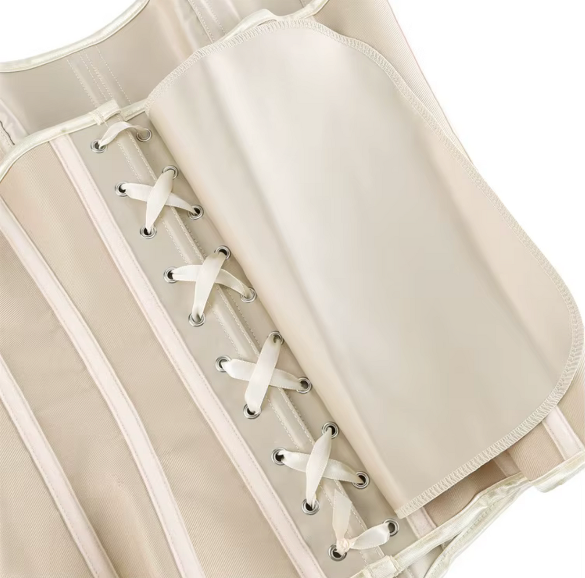 Beige satin Soli corset featuring structured boning, metal eyelets, and a white lace-up back closure detail.